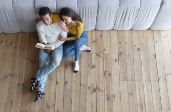 top-view-lovely-couple-reading-book